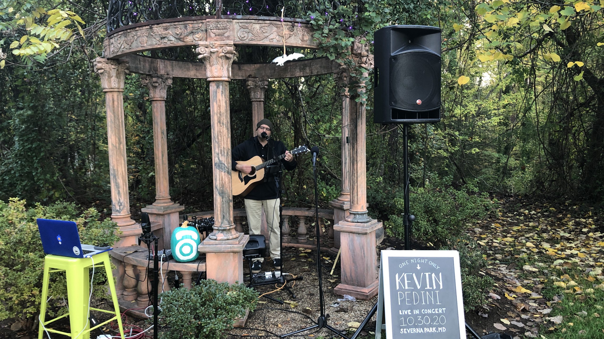 Kevin Pedini, one recipient of an employee recognition award, plays guitar at a company event.