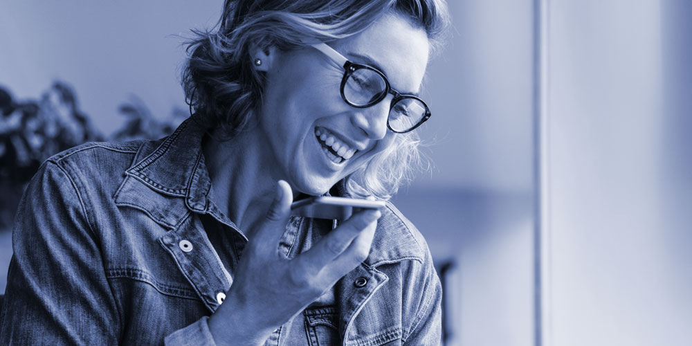 woman smiling and talking on cell phone