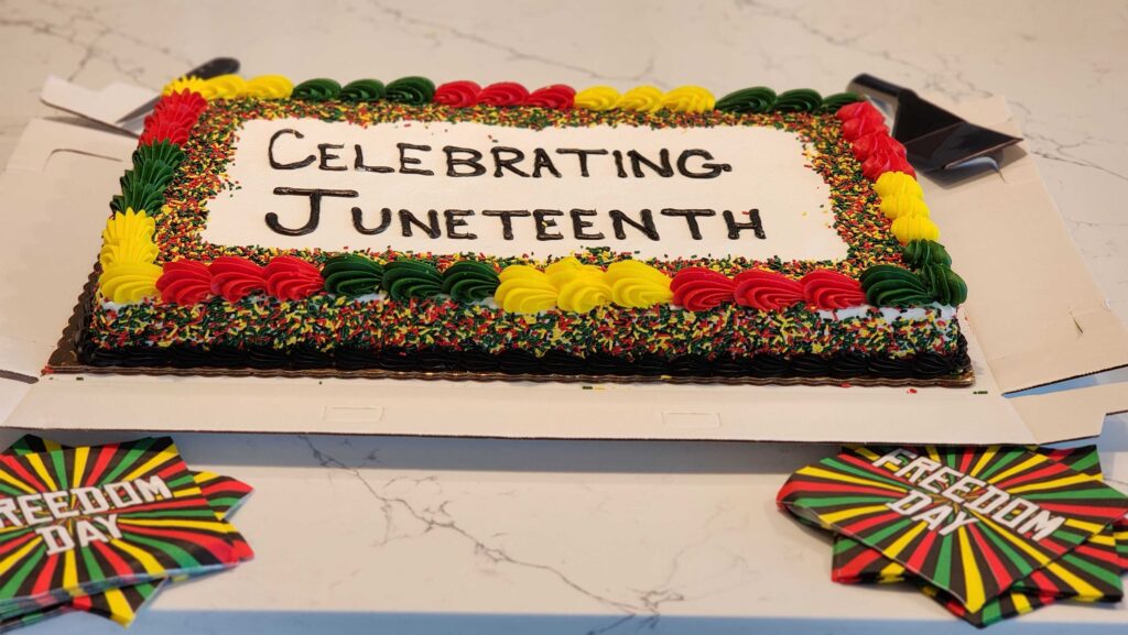 Celebrating Juneteenth with cake and colleagues at CallTrackingMetrics.