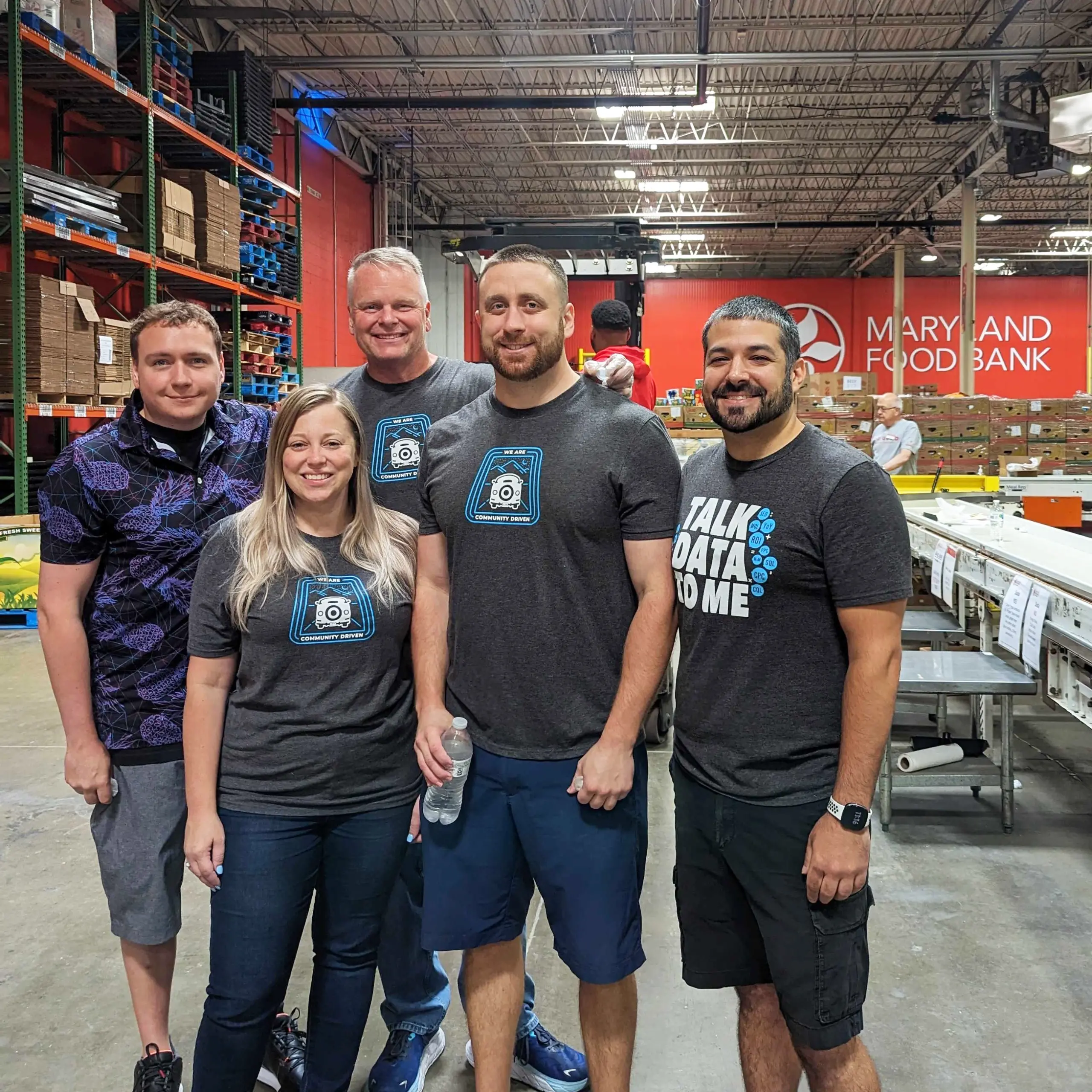 group of employees pose at the local food bank